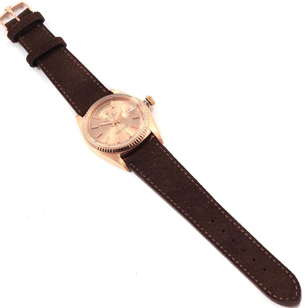 The image shows a top-down view of a Rolex President 1803 Men's Rose Gold Pink Dial 1803 Men's Rose Gold Pink Dial model watch with a brown leather strap.