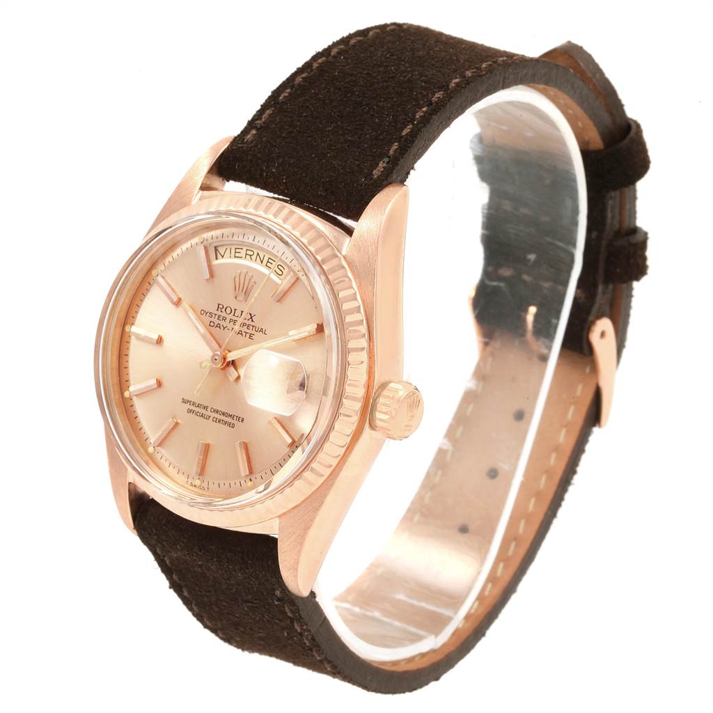 The image shows an angled view of the Rolex President 1803 Men's Rose Gold Pink Dial 1803 Men's Rose Gold Pink Dial model watch featuring the face, crown, and leather strap in focus.