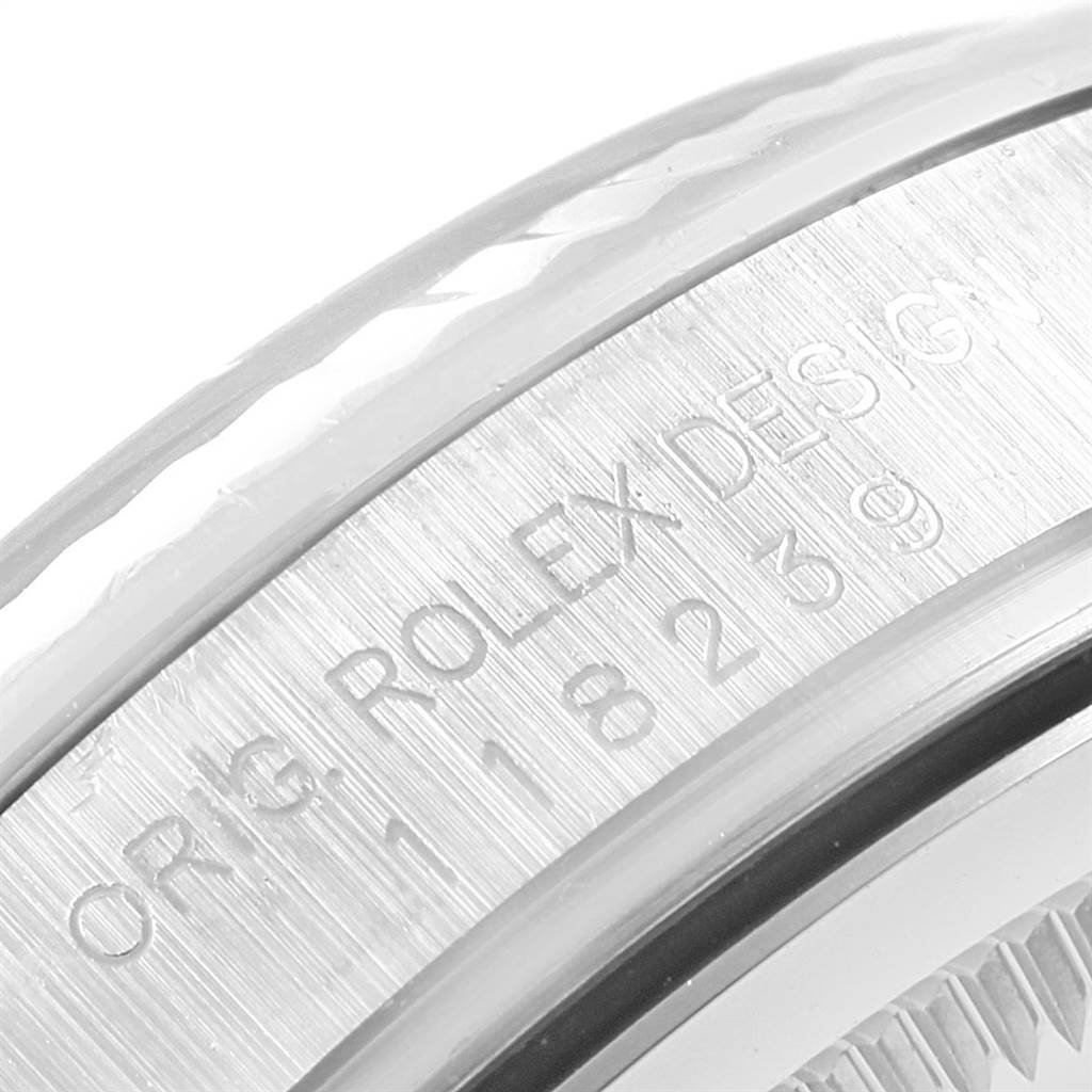 This image shows a close-up of the case side and bezel of the Rolex President 118239 Men's White Gold Silver Dial 118239 Men's White Gold Silver Dial model, focusing on the engraved text on the watch.