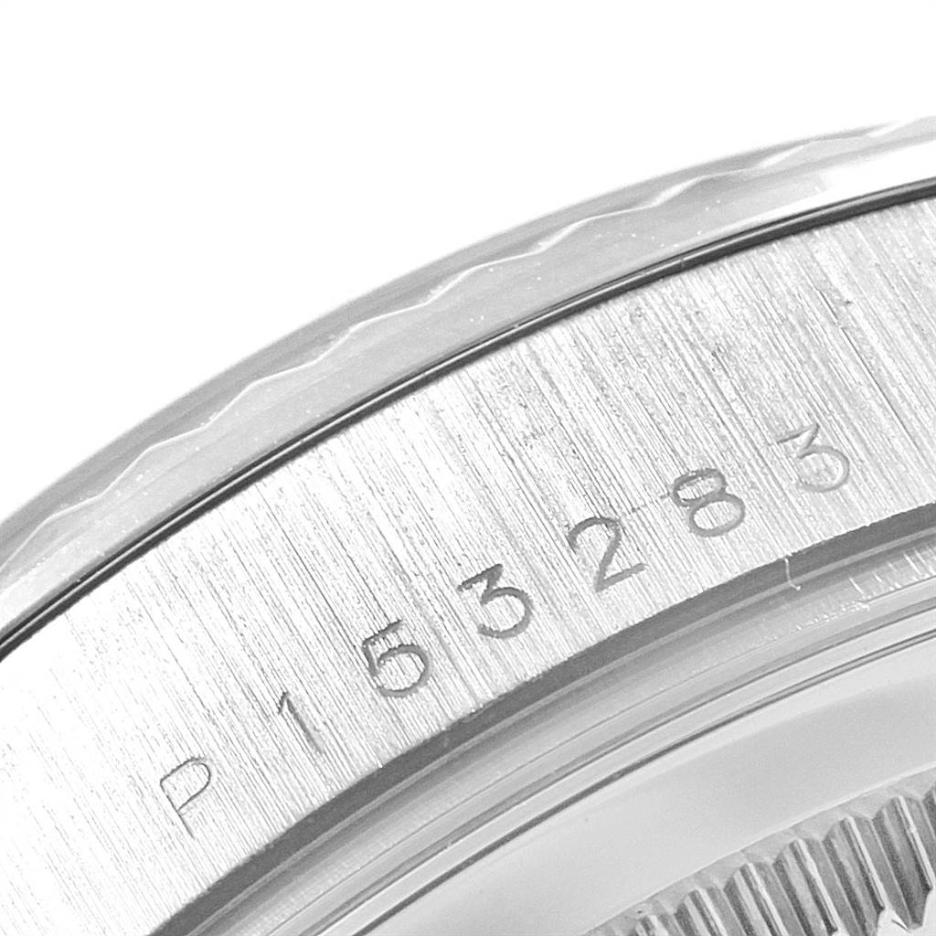 This image shows a close-up of the case side and serial number of a Rolex President 118239 Men's White Gold Silver Dial 118239 Men's White Gold Silver Dial model watch.
