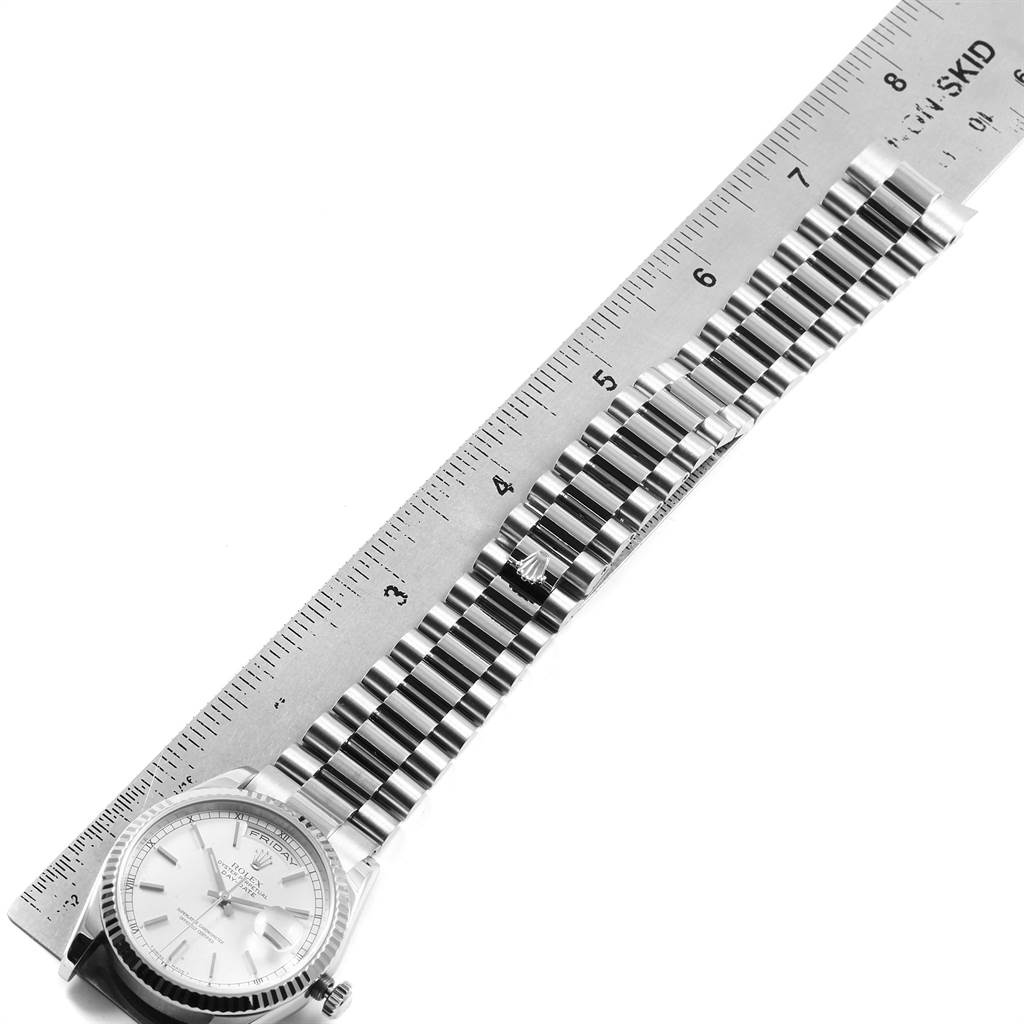 The image shows a top-down view of a Rolex President 118239 Men's White Gold Silver Dial 118239 Men's White Gold Silver Dial model watch with its face and bracelet measured against a ruler.