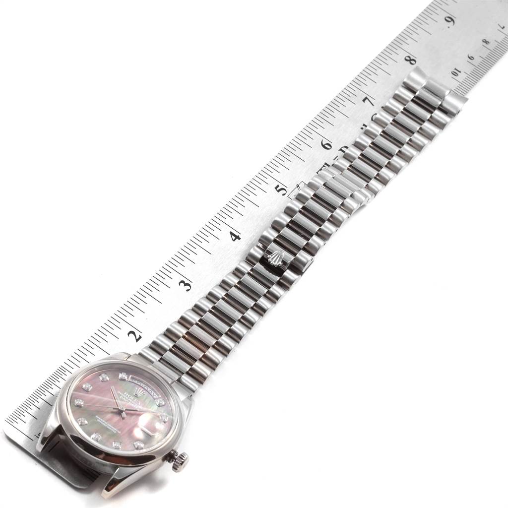 The image shows a Rolex President 118209 Men's White Gold Mother of Pearl Dial 118209 Men's White Gold Mother of Pearl Dial model watch laid flat with its face and bracelet fully visible, alongside a ruler for scale.