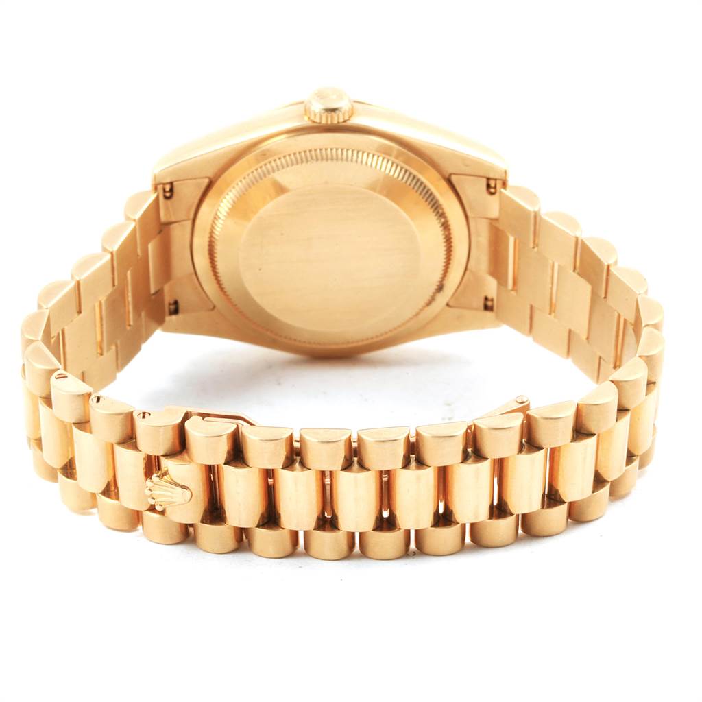 This image shows the back view of a Rolex President 118208 Men
s Yellow Gold Black Dial 118208 Men
s Yellow Gold Black Dial model watch, focusing on the bracelet and case back.