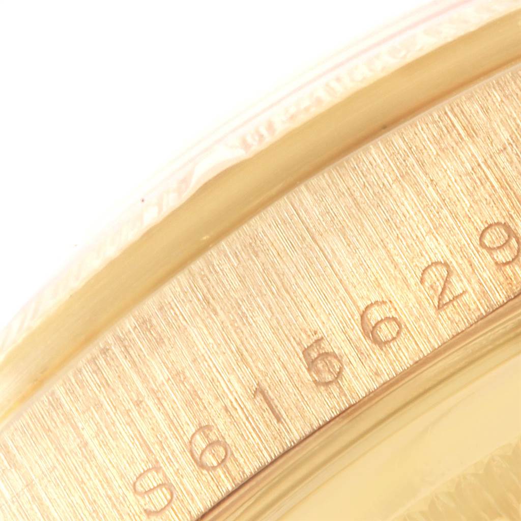 This close-up image shows a portion of the serial number engraved on the case of a Rolex President 18248 Men
s Yellow Gold Black Dial 18248 Men
s Yellow Gold Black Dial model watch.