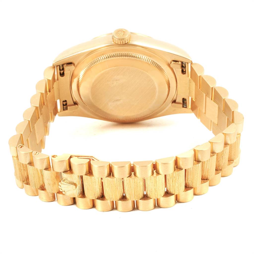 This image shows the backside of the Rolex President 18248 Men
s Yellow Gold Black Dial 18248 Men
s Yellow Gold Black Dial model watch, highlighting the case back and bracelet.