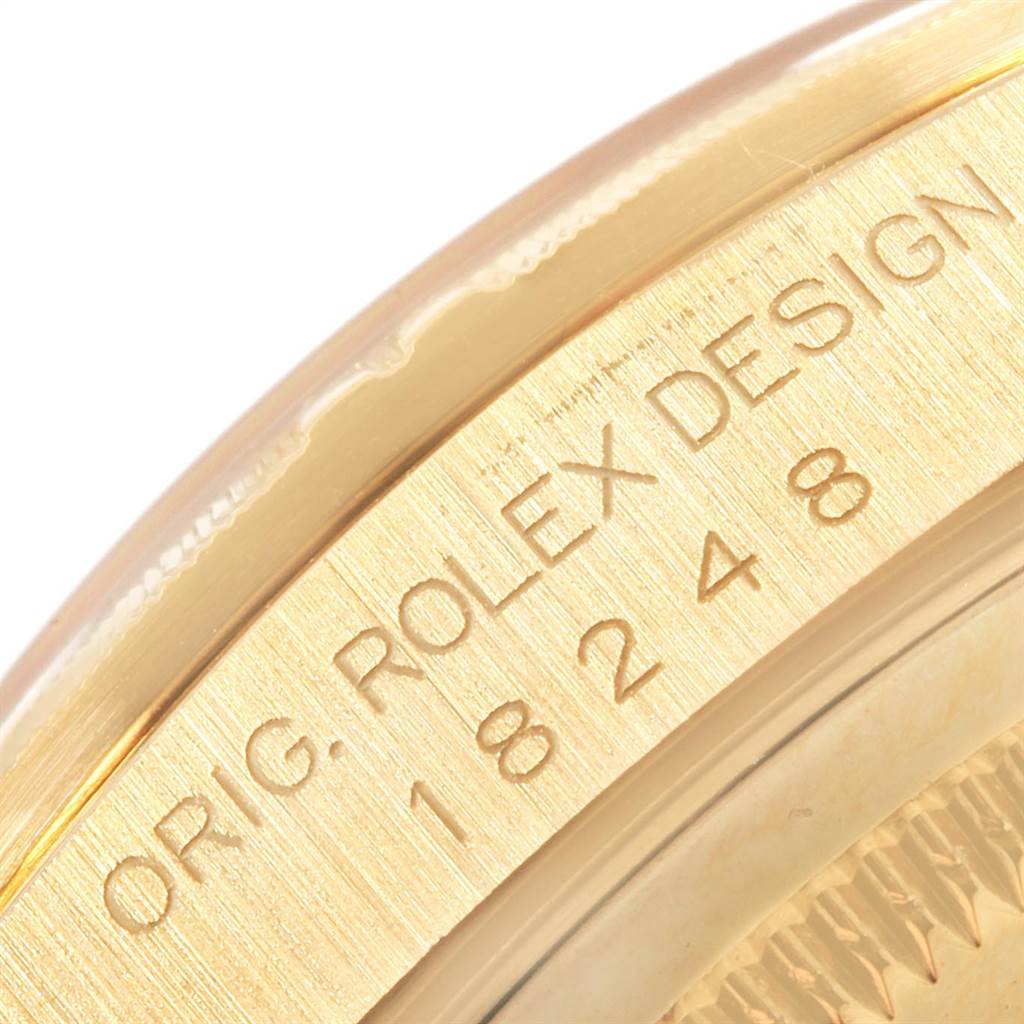 This image shows a close-up of the case edge of the Rolex President 18248 Men
s Yellow Gold Black Dial 18248 Men
s Yellow Gold Black Dial model, displaying the engraving "ORIG. ROLEX DESIGN 18248."