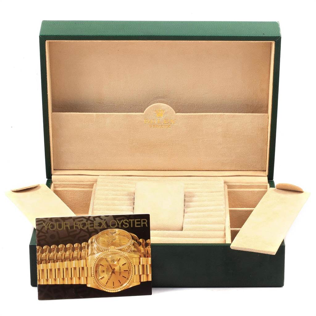 A Rolex President 18239 Men's White Gold Brown Dial 18239 Men's White Gold Brown Dial watch box is open, showing compartments and a card displaying the watch.