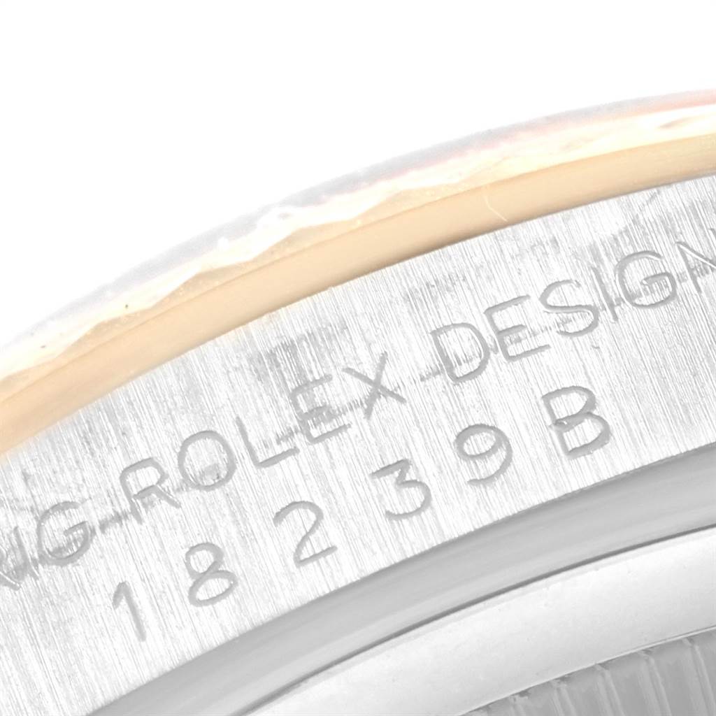 This image shows a close-up of the engraved bezel and case back of a Rolex President 18239 Men's White Gold Brown Dial 18239 Men's White Gold Brown Dial watch.