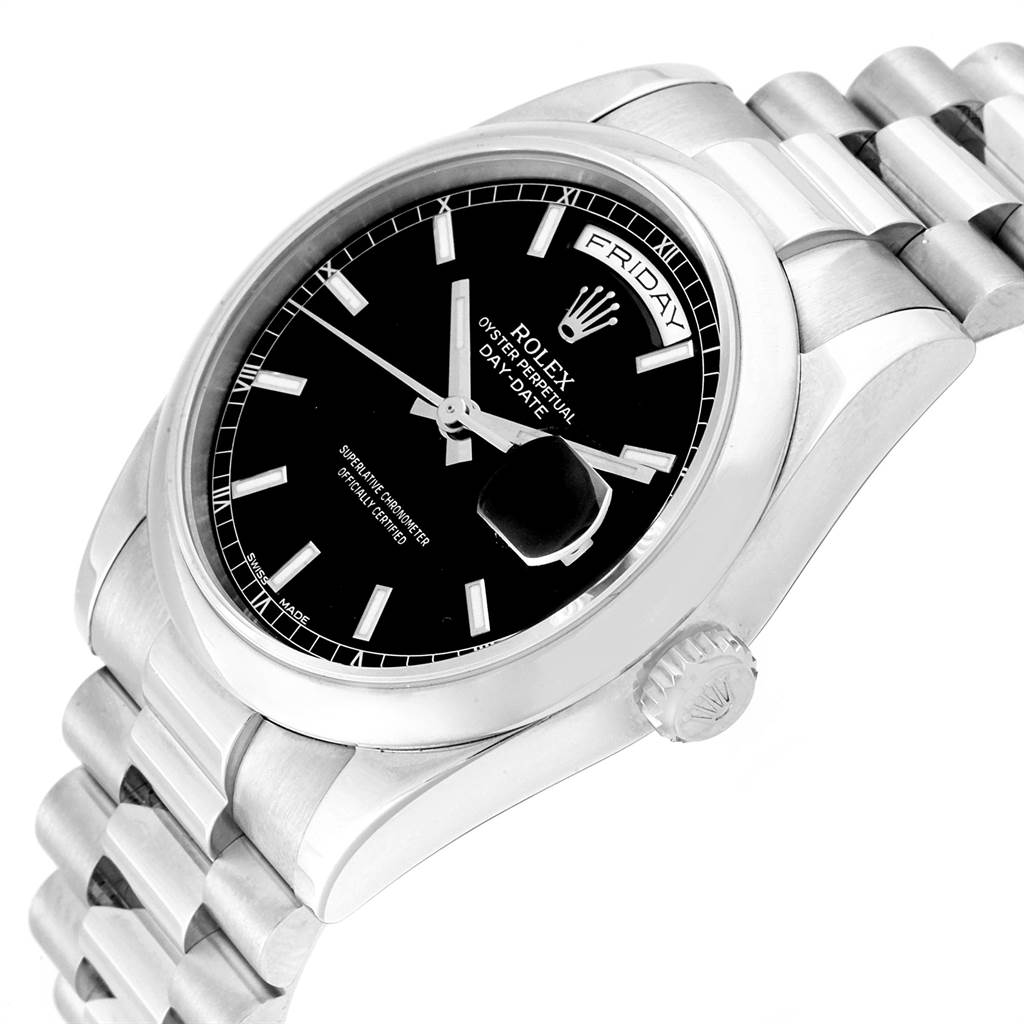 The image shows a Rolex President 118209 Men's White Gold Black Dial 118209 Men's White Gold Black Dial model watch at an angled view, highlighting the black dial, day-date display, and stainless steel bracelet.