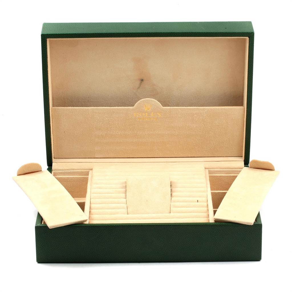 The image shows an open green and cream Rolex President 118209 Men's White Gold Black Dial 118209 Men's White Gold Black Dial watch box with compartments for storing the watch and accessories.