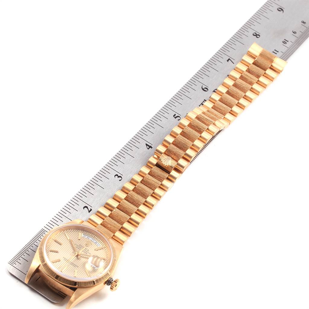 The image shows a Rolex President 18248 Men
s Yellow Gold Champagne Dial 18248 Men
s Yellow Gold Champagne Dial model watch laid flat next to a ruler, displaying its full bracelet length and watch face.