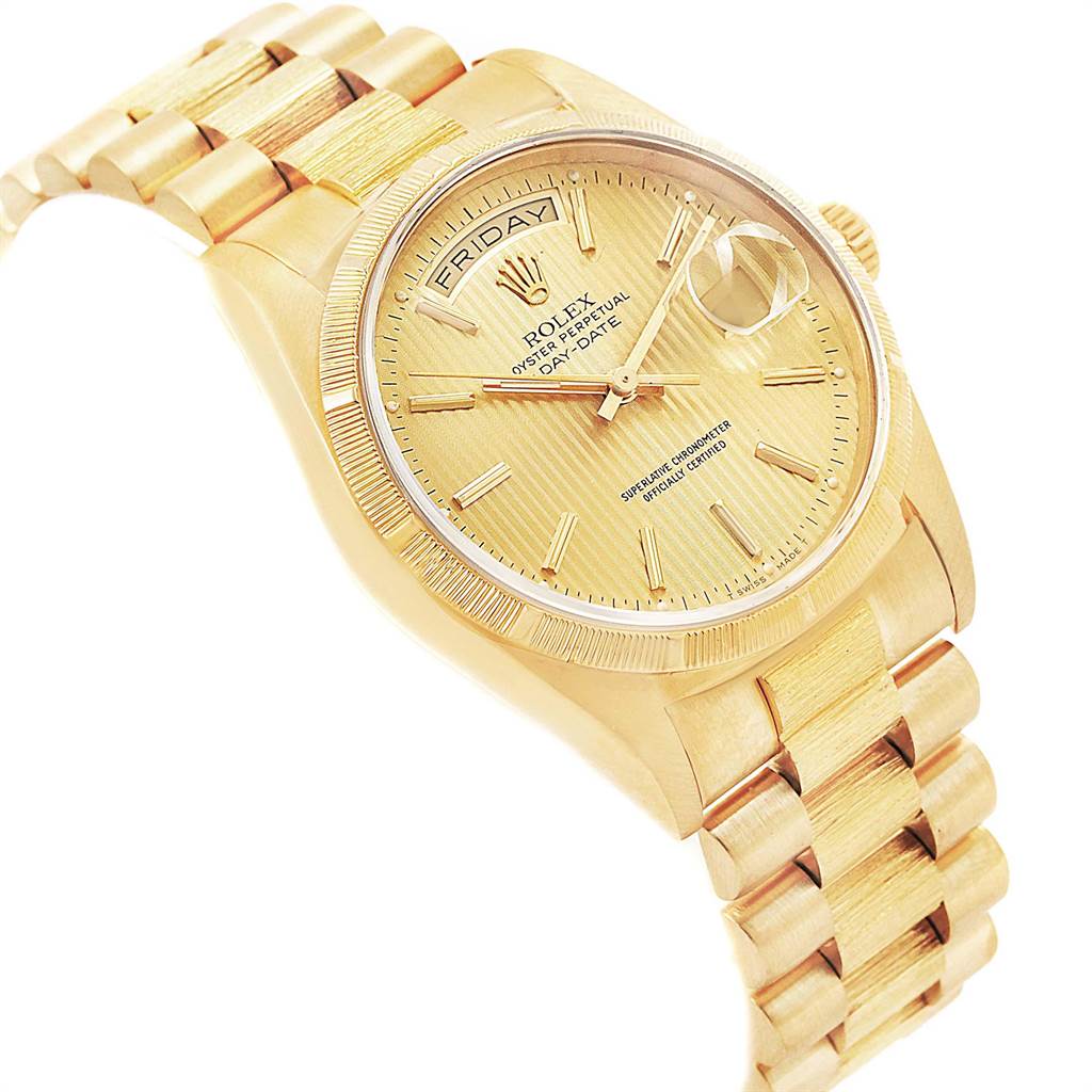 The image shows a close-up angle of a gold Rolex President 18248 Men
s Yellow Gold Champagne Dial 18248 Men
s Yellow Gold Champagne Dial model, highlighting its bracelet, dial, hands, and fluted bezel.