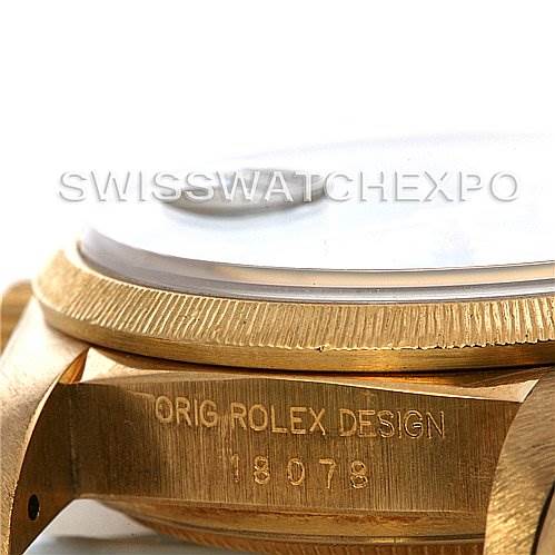 The image shows a close-up angle of the side of a Rolex President 18038 Men's Yellow Gold Blue Dial 18038 Men's Yellow Gold Blue Dial model watch, focusing on the bezel, casing, and engraved design number.