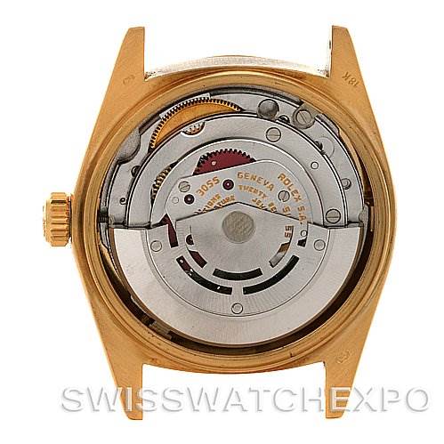 The image shows the back view of a Rolex President 18038 Men's Yellow Gold Blue Dial 18038 Men's Yellow Gold Blue Dial model watch, revealing its internal movement and mechanisms.