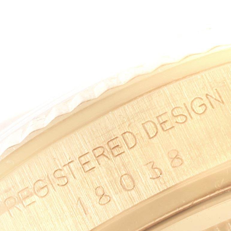 The image shows a close-up of the side engraving on a Rolex President 18038 Men
s Yellow Gold Brown Dial 18038 Men
s Yellow Gold Brown Dial model watch.