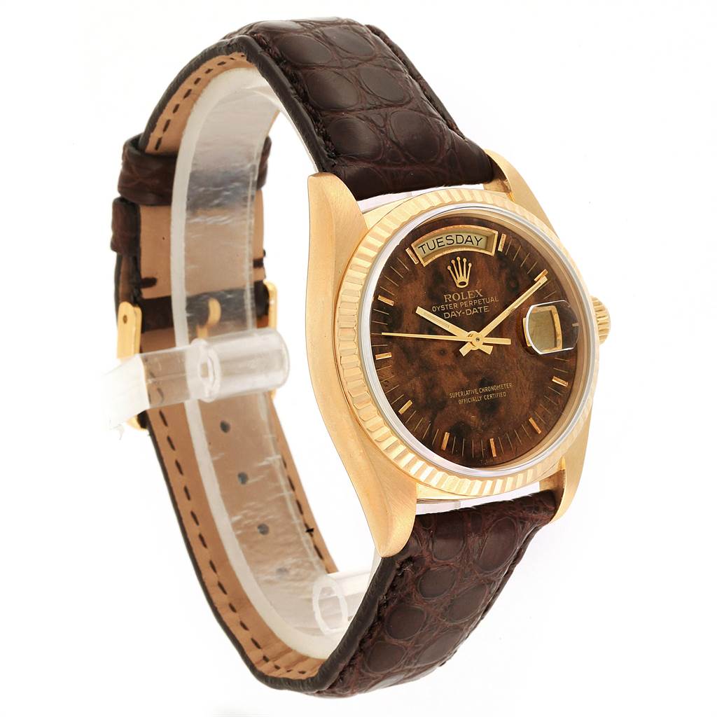 The image shows a side angle view of a Rolex President 18038 Men
s Yellow Gold Brown Dial 18038 Men
s Yellow Gold Brown Dial watch, featuring a brown leather strap and gold casing.
