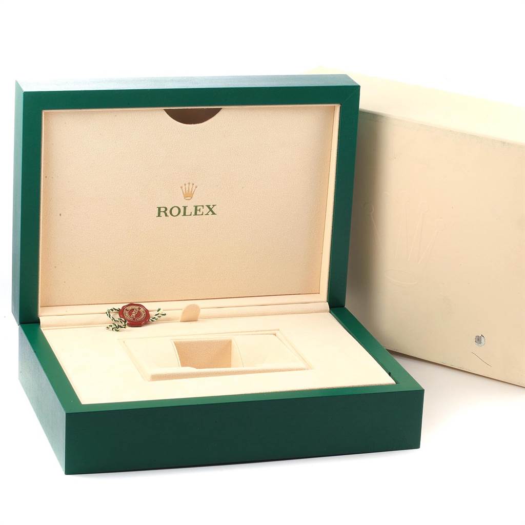 The image shows an open Rolex box for the President model, with the inside compartment and the lid visible.