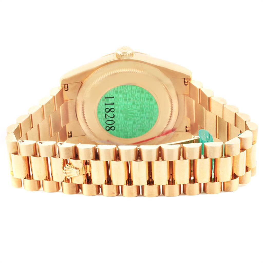 The image shows the back view of a Rolex President 118208 Men
s Yellow Gold Silver Dial 118208 Men
s Yellow Gold Silver Dial model watch, focusing on its case back and bracelet.