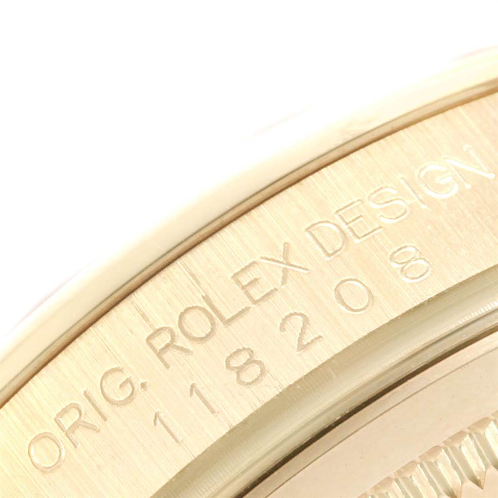 The image shows a close-up of the case side, displaying the engraving "Orig. Rolex Design" with the model number of a Rolex President 118208 Men
s Yellow Gold Silver Dial 118208 Men
s Yellow Gold Silver Dial watch.
