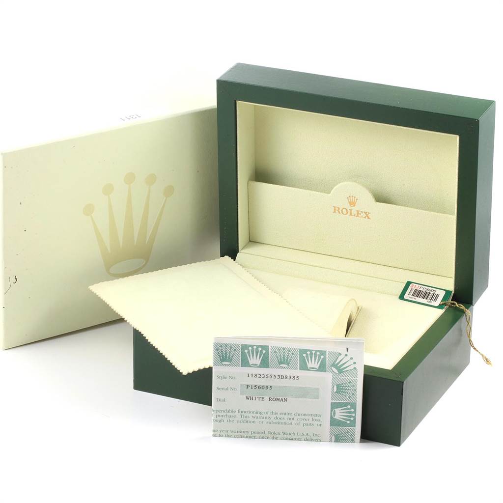 The image shows the packaging for a Rolex President 118235 Men's Rose Gold White Dial 118235 Men's Rose Gold White Dial model watch, including a green box, cushion, authenticity card, and cleaning cloth.