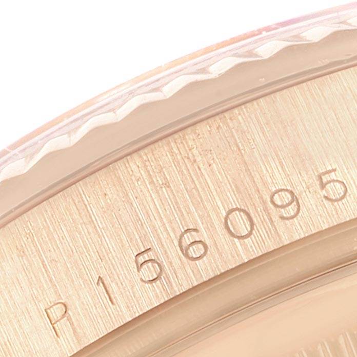 This image shows a close-up view of the side of a Rolex President 118235 Men's Rose Gold White Dial 118235 Men's Rose Gold White Dial model, focusing on the serial number engraving.