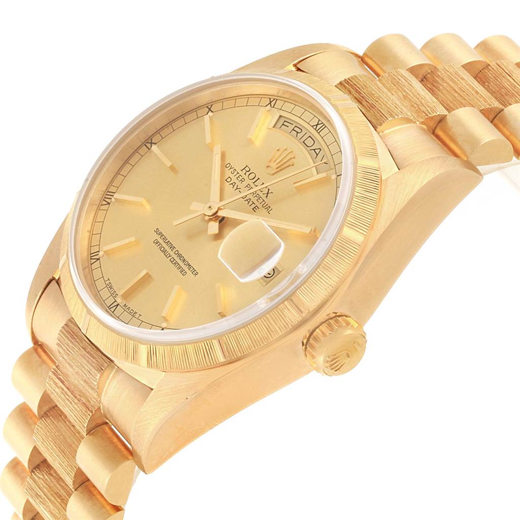 The image shows a Rolex President 18078 Men
s Yellow Gold Champagne Dial 18078 Men
s Yellow Gold Champagne Dial model watch at an oblique angle, highlighting the dial, bezel, and part of the bracelet.
