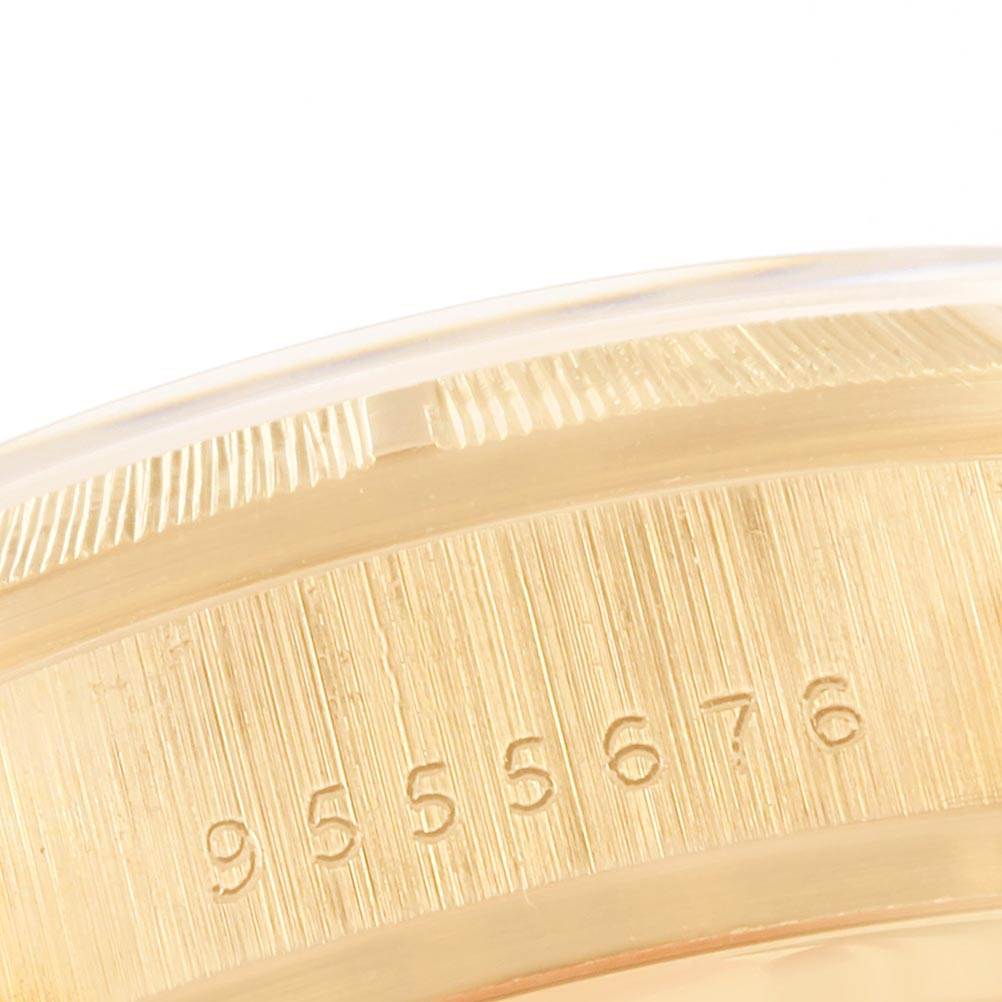 The image shows a close-up of the serial number engraved on the bezel of a Rolex President 18078 Men
s Yellow Gold Champagne Dial 18078 Men
s Yellow Gold Champagne Dial model watch.