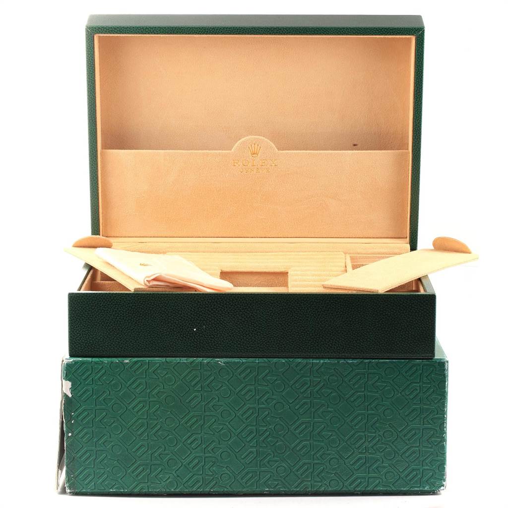 This image shows an open green box and interior packaging for a Rolex President 118338 Men
s Yellow Gold White Dial 118338 Men
s Yellow Gold White Dial model watch, viewed from the front.
