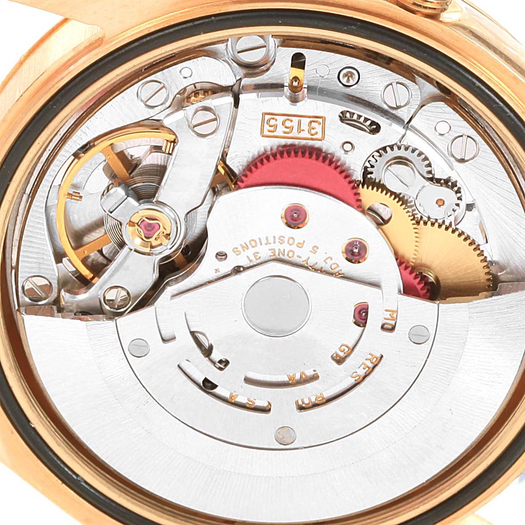This image shows a close-up view of the internal mechanical movement of a Rolex President 118338 Men
s Yellow Gold White Dial 118338 Men
s Yellow Gold White Dial model watch.