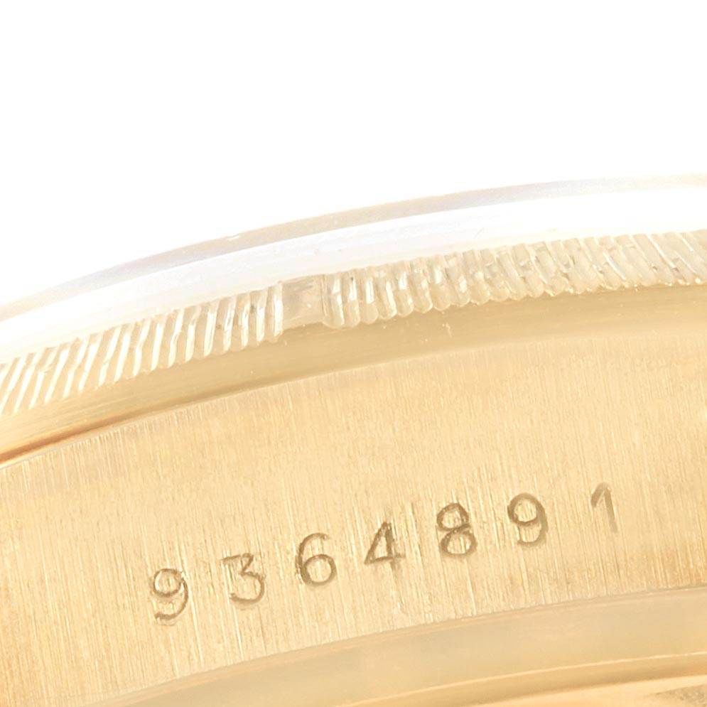 This image shows a close-up of the serial number on the bezel of a Rolex President 18078 Men
s Yellow Gold Champagne Dial 18078 Men
s Yellow Gold Champagne Dial model watch.
