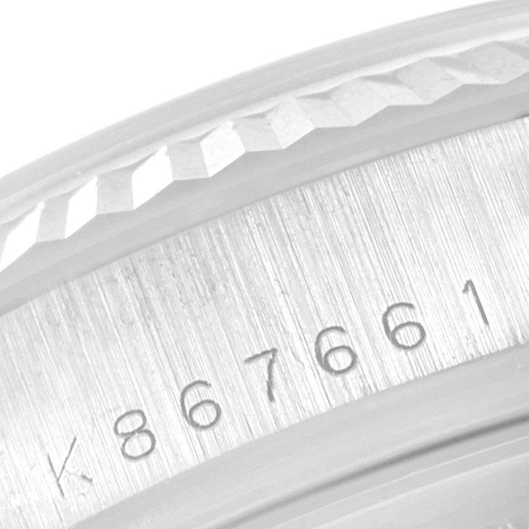 This image shows a close-up angle of the engraved serial number on the casing of a Rolex President 118239 Men's White Gold Silver Dial 118239 Men's White Gold Silver Dial model watch.