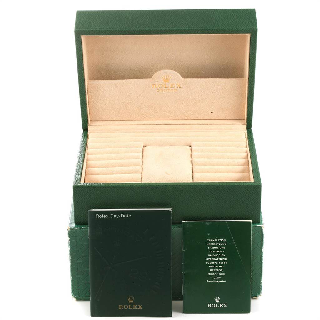 This image shows the open green case and booklets for a Rolex President 118239 Men's White Gold Silver Dial 118239 Men's White Gold Silver Dial model watch.