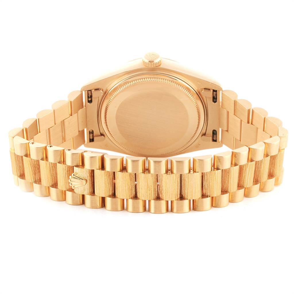 The image shows the back view of a Rolex President 18078 Men
s Yellow Gold Champagne Dial 18078 Men
s Yellow Gold Champagne Dial model watch, highlighting its gold case and bracelet.