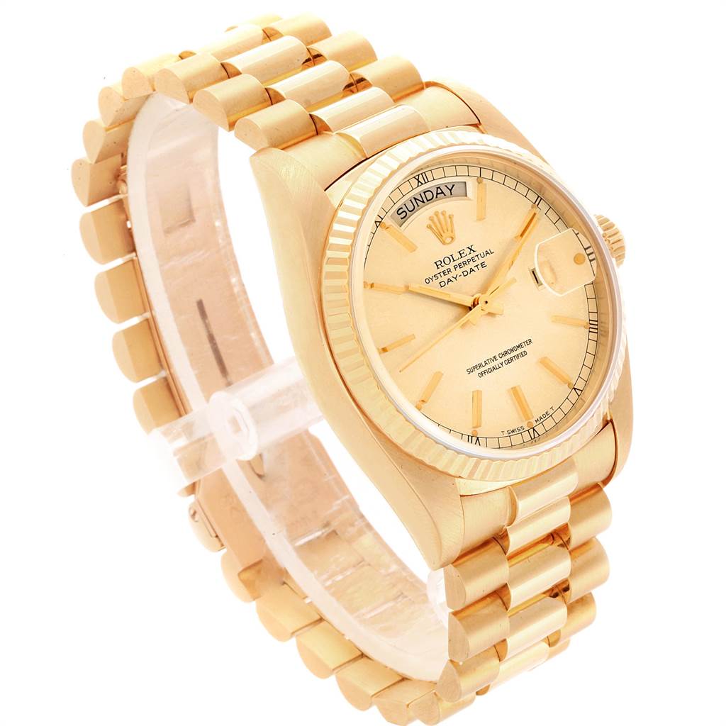 This image shows a Rolex President 18038 Men's Yellow Gold Champagne Dial 18038 Men's Yellow Gold Champagne Dial model watch from a three-quarter angle, highlighting the bracelet, dial, and fluted bezel.