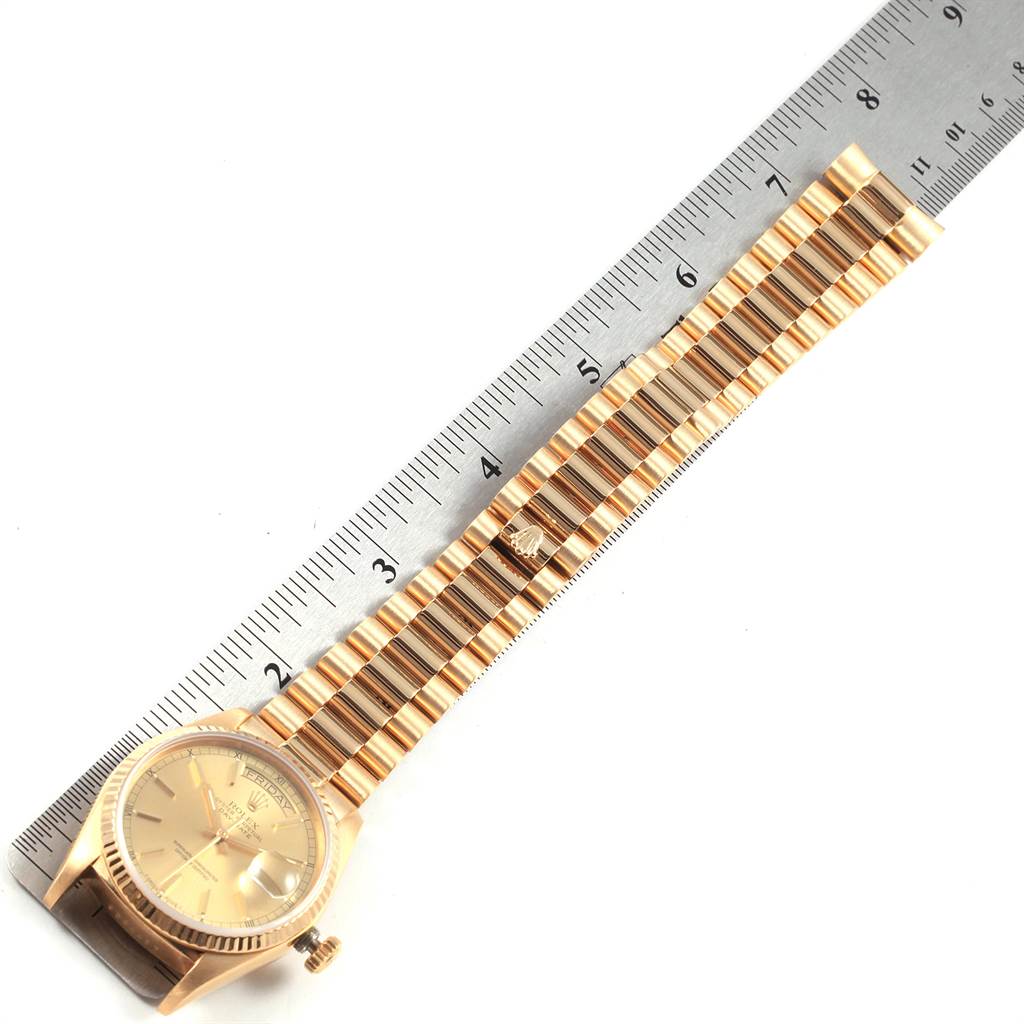 The image shows a Rolex President 18038 Men's Yellow Gold Champagne Dial 18038 Men's Yellow Gold Champagne Dial model watch laid flat next to a ruler, displaying the watch face and full bracelet.