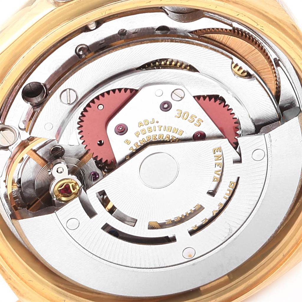 The image shows the internal mechanical movement of a Rolex President 18038 Men's Yellow Gold Champagne Dial 18038 Men's Yellow Gold Champagne Dial model watch with detailed gears and components.