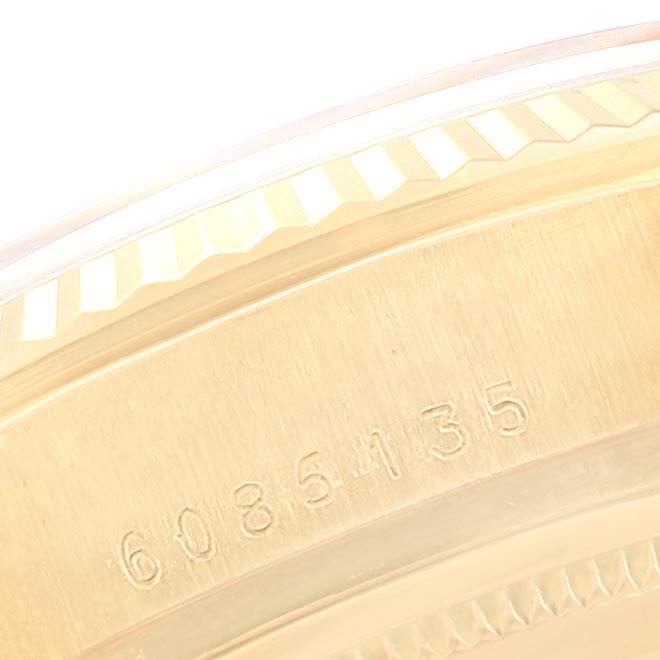 The image shows a close-up view of the Rolex President 18038 Men's Yellow Gold Champagne Dial 18038 Men's Yellow Gold Champagne Dial model’s edge, highlighting serial and reference numbers.