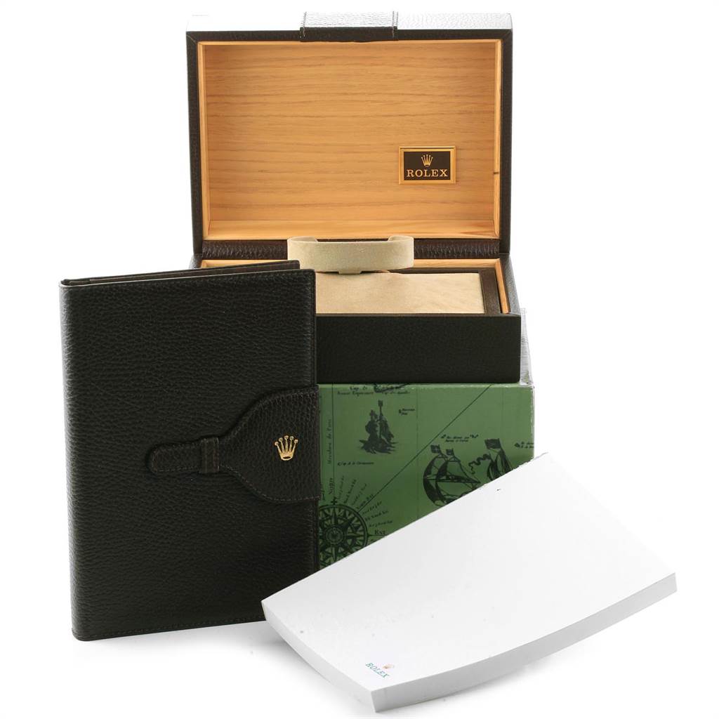 The image shows the packaging and accessories of a Rolex President 18078 Men's Yellow Gold Champagne Dial 18078 Men's Yellow Gold Champagne Dial model, including its box, booklet, and paperwork.
