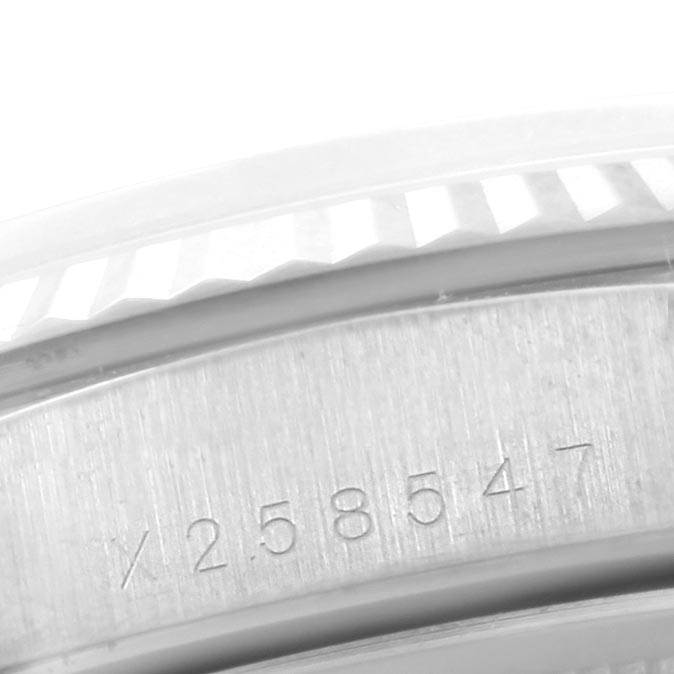 The image shows a close-up of the serial number engraved on the side of the bezel of the Rolex President 18239 Men's White Gold Silver Dial 18239 Men's White Gold Silver Dial model watch.