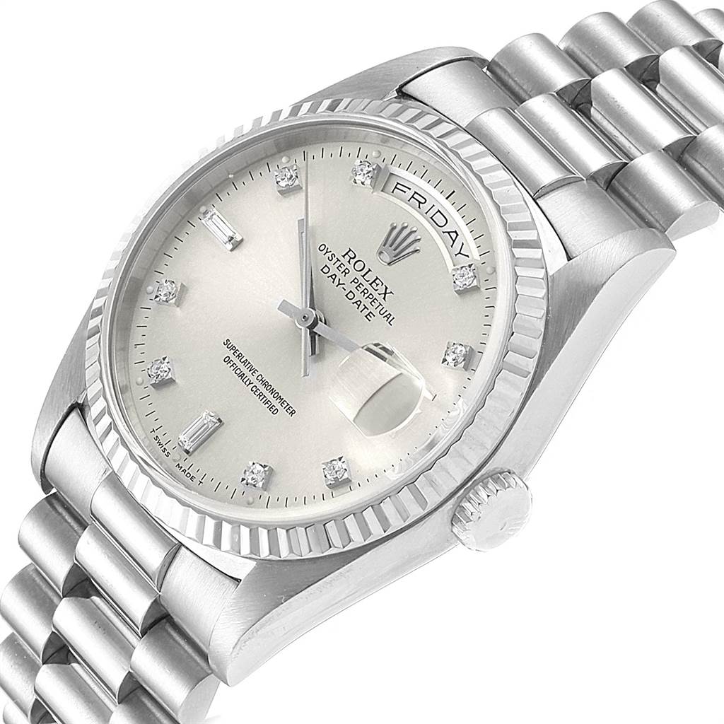 The President model by Rolex is shown from an angled view, highlighting the dial, crown, and bracelet.