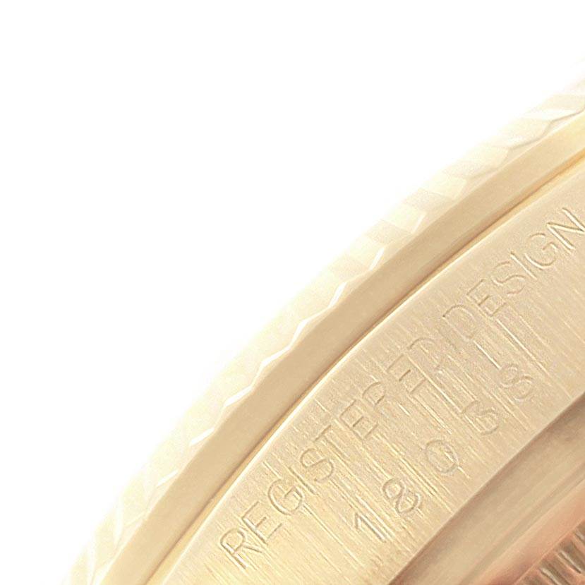 This close-up image shows the edge and some engravings on the case back of a Rolex President 18038 Men's Yellow Gold Champagne Dial 18038 Men's Yellow Gold Champagne Dial model.