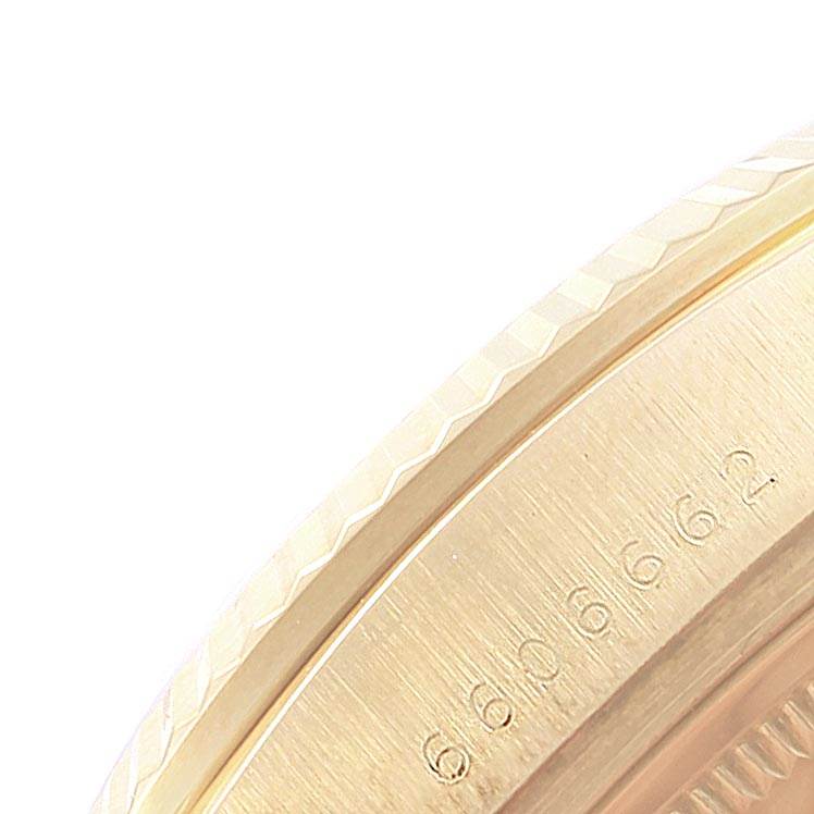 This image shows a close-up view of the edge and part of the case back of a Rolex President 18038 Men's Yellow Gold Champagne Dial 18038 Men's Yellow Gold Champagne Dial model watch.