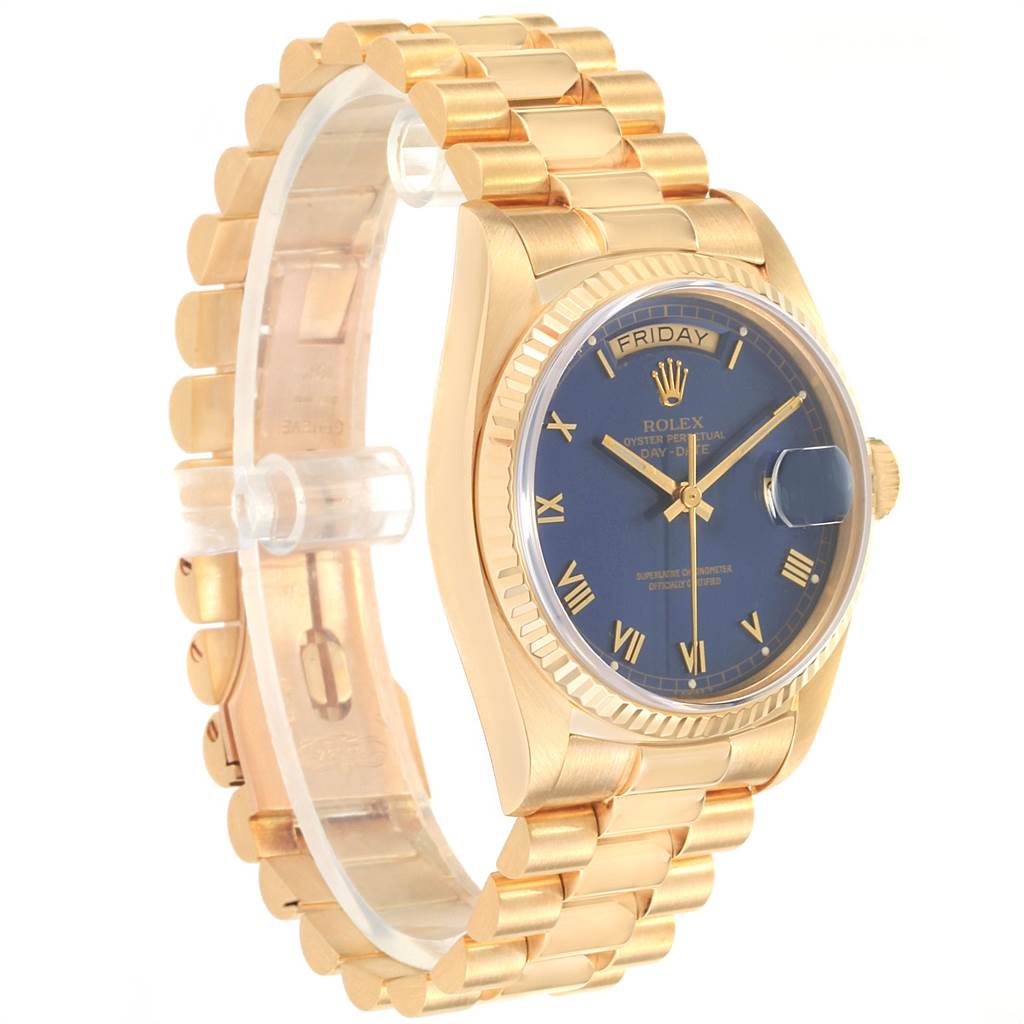 The Rolex President 18038 Men's Yellow Gold Blue Dial 18038 Men's Yellow Gold Blue Dial watch is shown at a 3/4 angle, displaying its gold bracelet, blue dial, and day-date window.