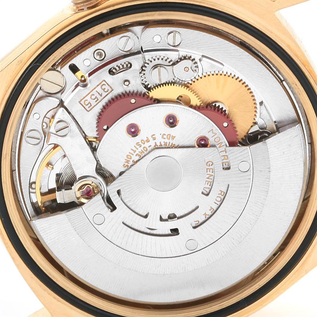 The image shows the internal mechanism of a Rolex President 18238 Men
s Yellow Gold Champagne Dial 18238 Men
s Yellow Gold Champagne Dial model watch from a rear angle, highlighting gears and the rotor.