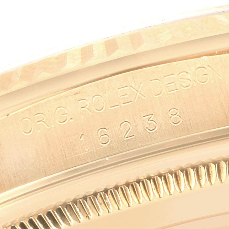 Close-up of the side crown area of a Rolex President 16238 Men
s Yellow Gold Brown Dial 16238 Men
s Yellow Gold Brown Dial model watch, showing engraved serial numbers.