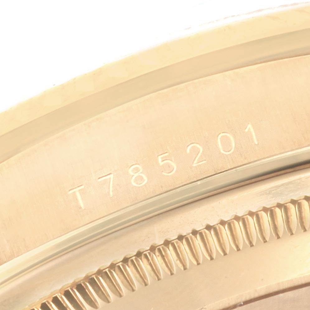 The image shows a close-up of the case back with model number T785201 of the Rolex President 16238 Men
s Yellow Gold Brown Dial 16238 Men
s Yellow Gold Brown Dial watch.