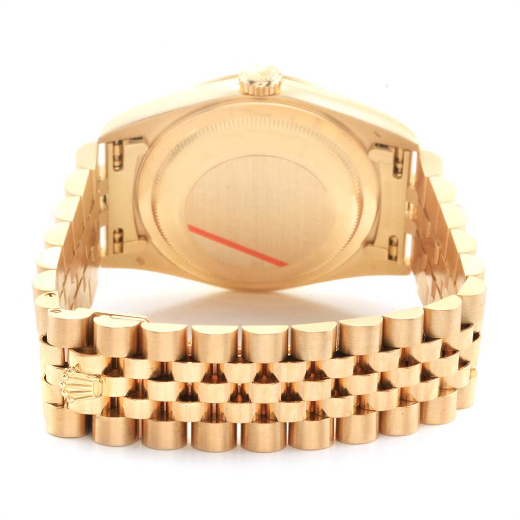 The image shows the backside and bracelet of a Rolex President 16238 Men
s Yellow Gold Brown Dial 16238 Men
s Yellow Gold Brown Dial model watch.