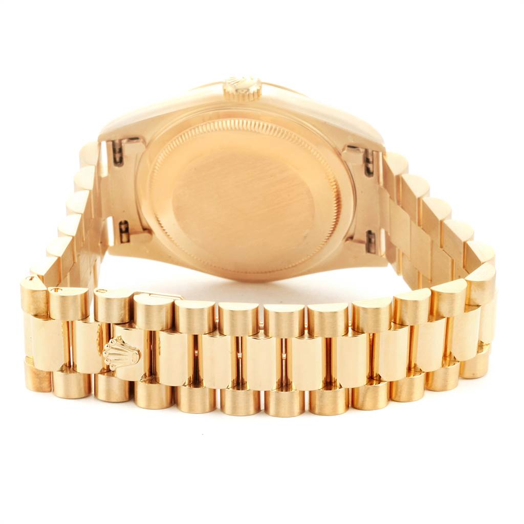 The image shows the backside of a Rolex President 18238 Men
s Yellow Gold Black Dial 18238 Men
s Yellow Gold Black Dial model watch, highlighting the case back and bracelet.