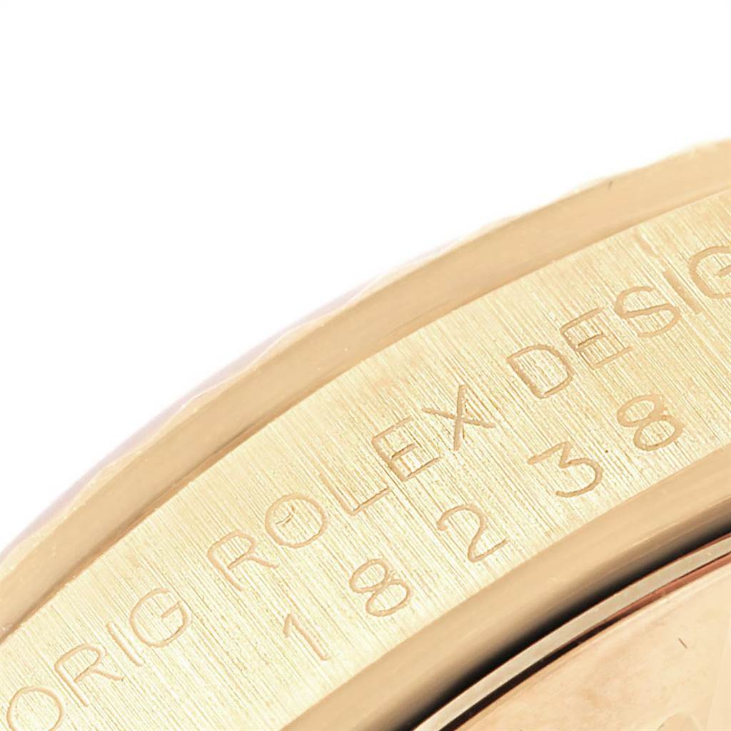 The image shows a close-up view of the edge and engraved design numbers of the Rolex President 18238 Men
s Yellow Gold Black Dial 18238 Men
s Yellow Gold Black Dial model watch.