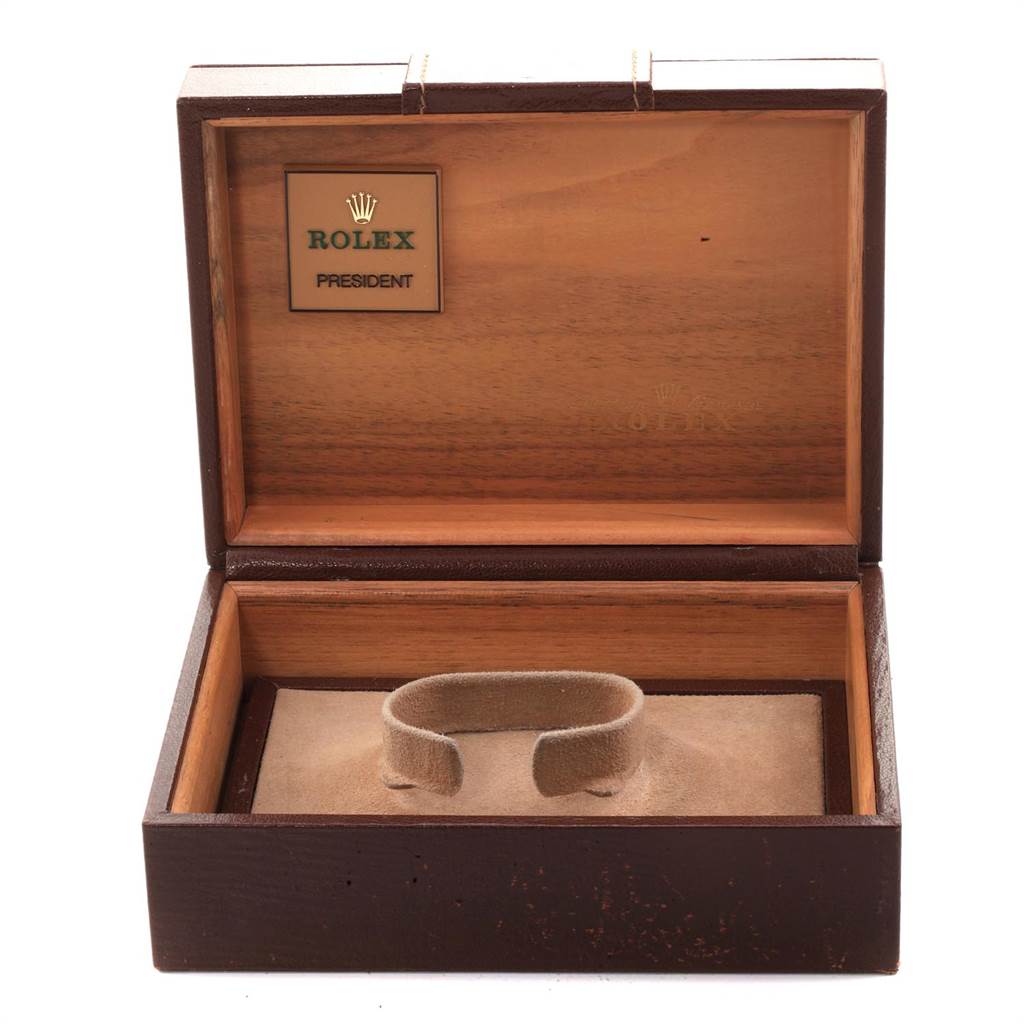 The image displays an open wooden presentation box for a Rolex President 18238 Men
s Yellow Gold Black Dial 18238 Men
s Yellow Gold Black Dial model watch, without the watch inside.